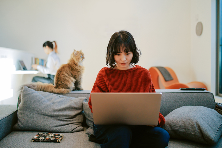 Roommates working together at home in Tokyo, Japan