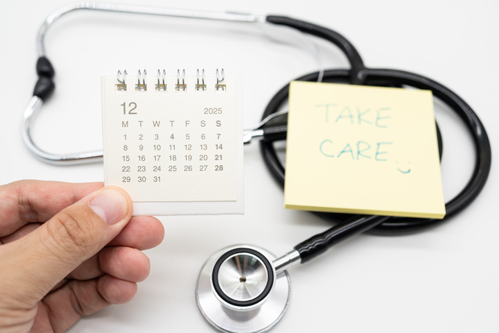 Medical Appointment Concept with 2025 DECEMBER Calendar, Take care note and Stethoscope. symbolizing healthcare appointments, medical checkups, and patient consultation scheduling. Copy space.