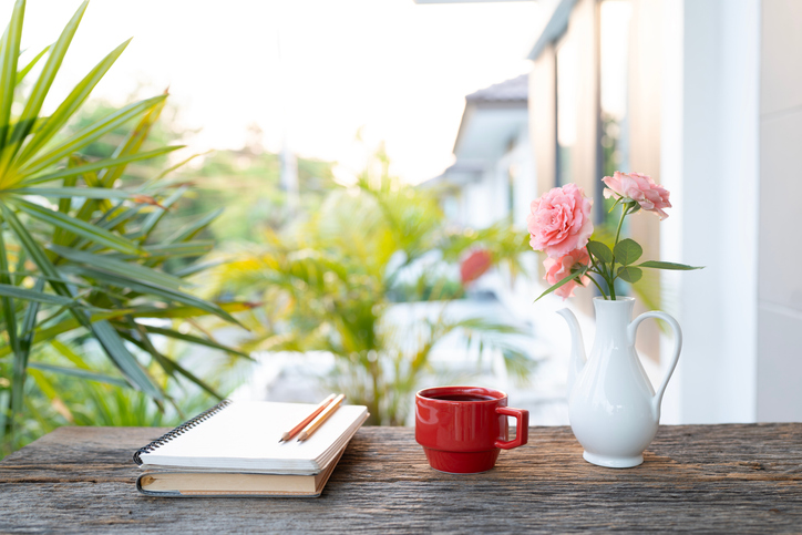Notebooks and pencil, Cozy writing and red coffee with vase of pink